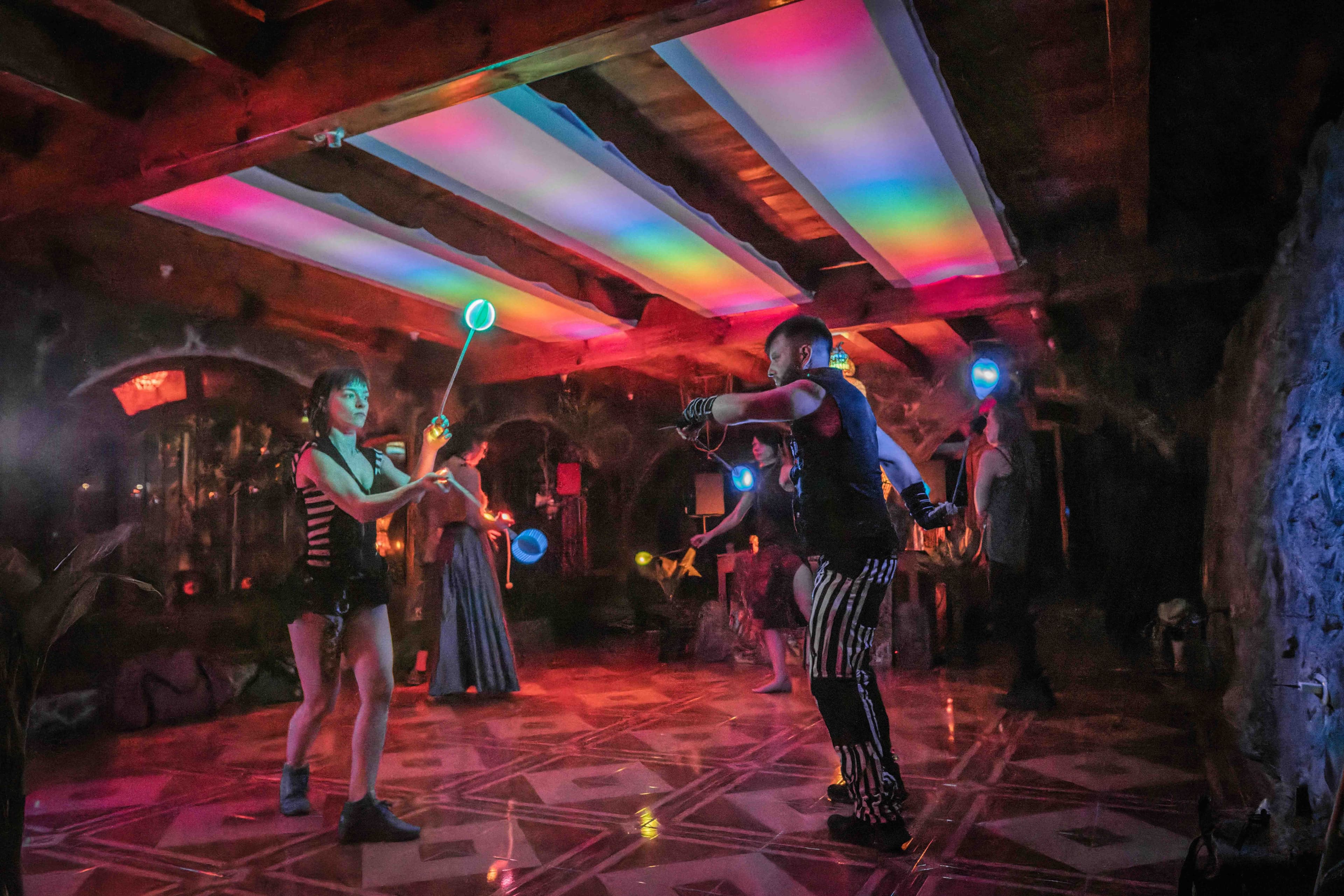 Glowing duo on a festival-colored stage