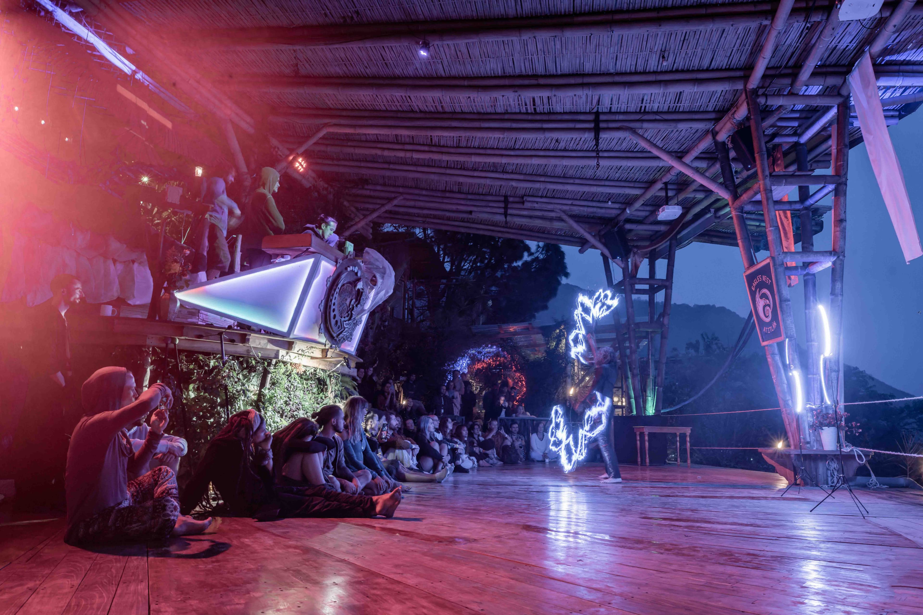 Night concert stage bathed in purple light
